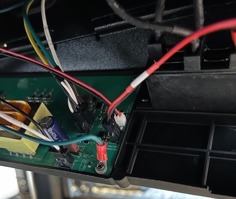 Image showing the green ground wire and screw to remove. 