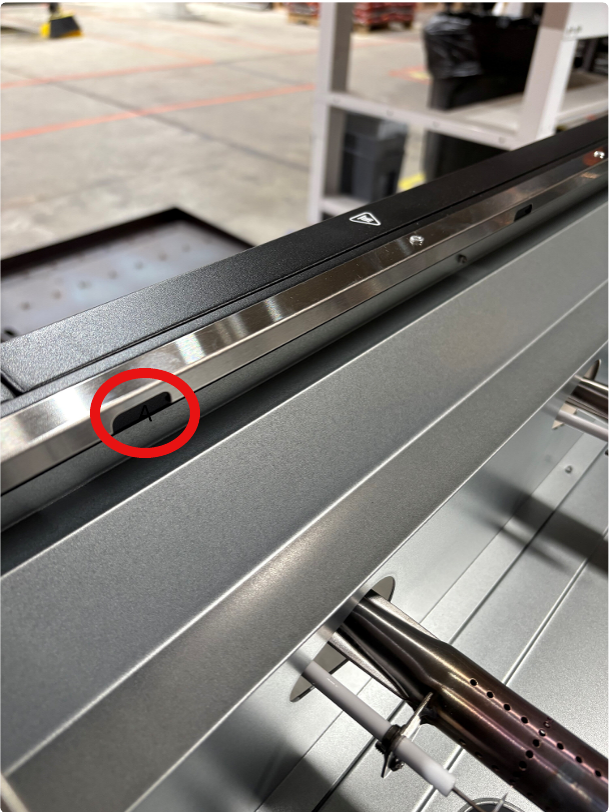 Image with red circle indicating area where screws are located. 