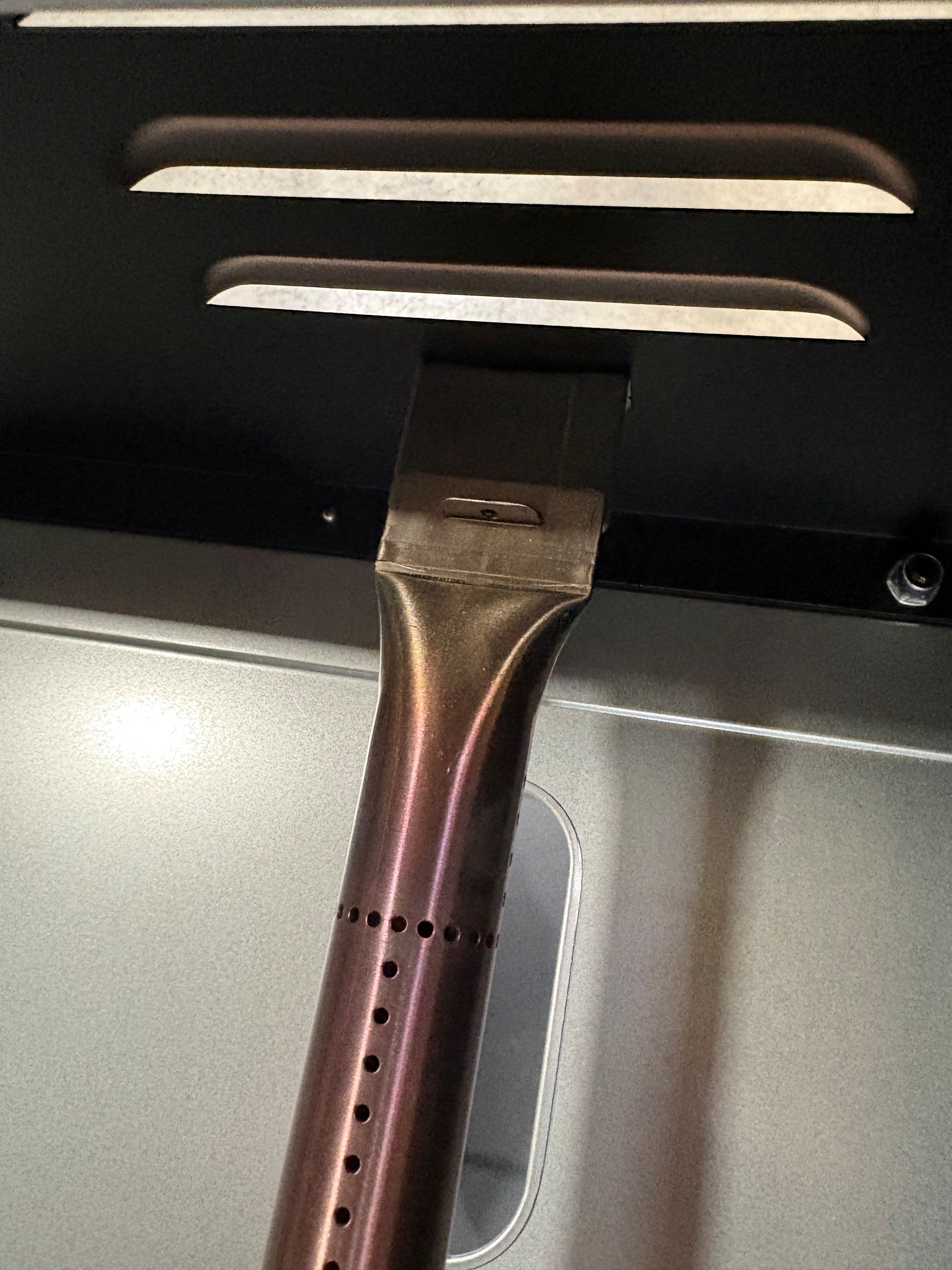 Image showing where to find the hairpin on the 4-burner grill.