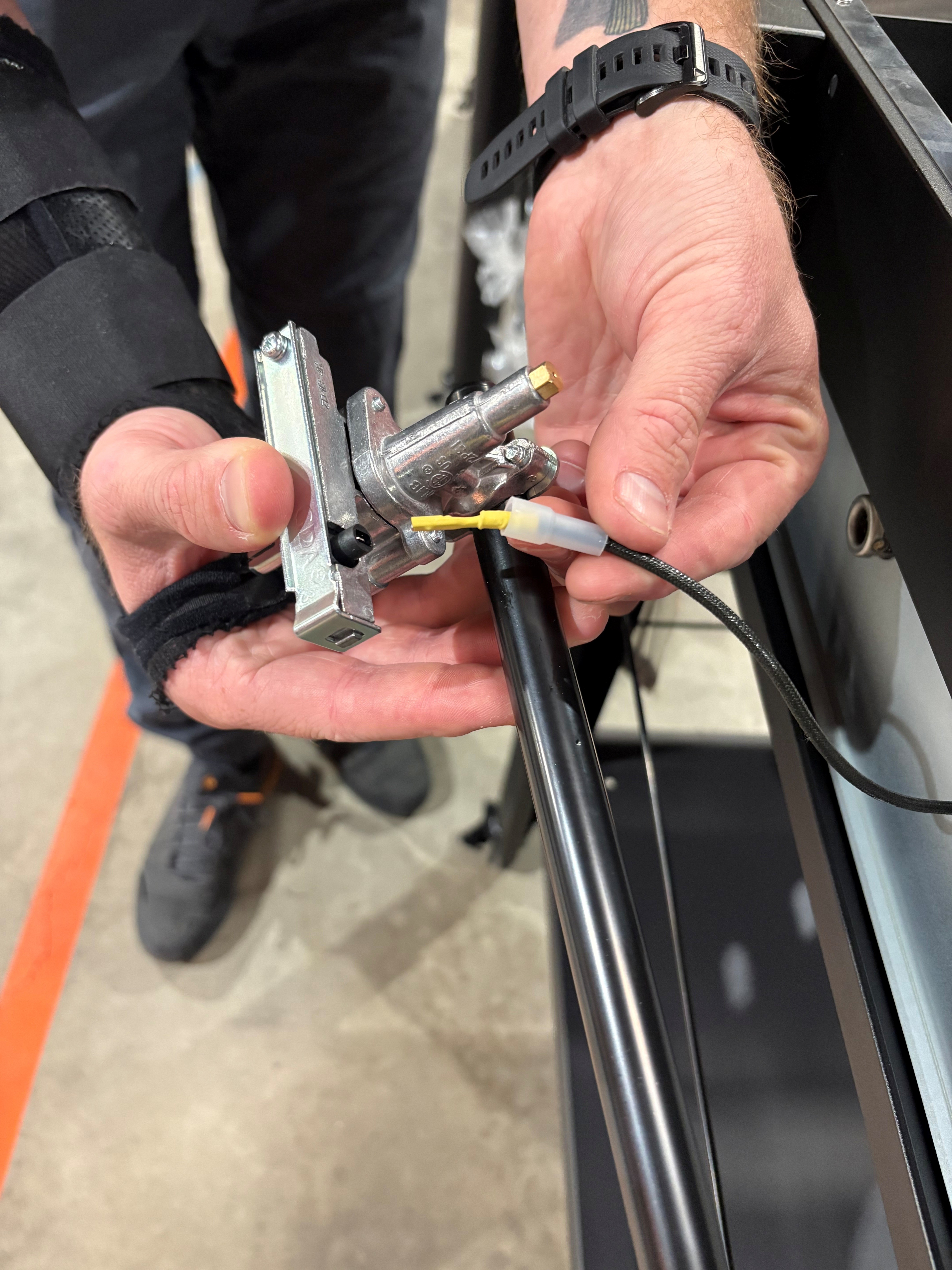 Image showing how to thread the ignitor wire and how to attach the gas manifold.