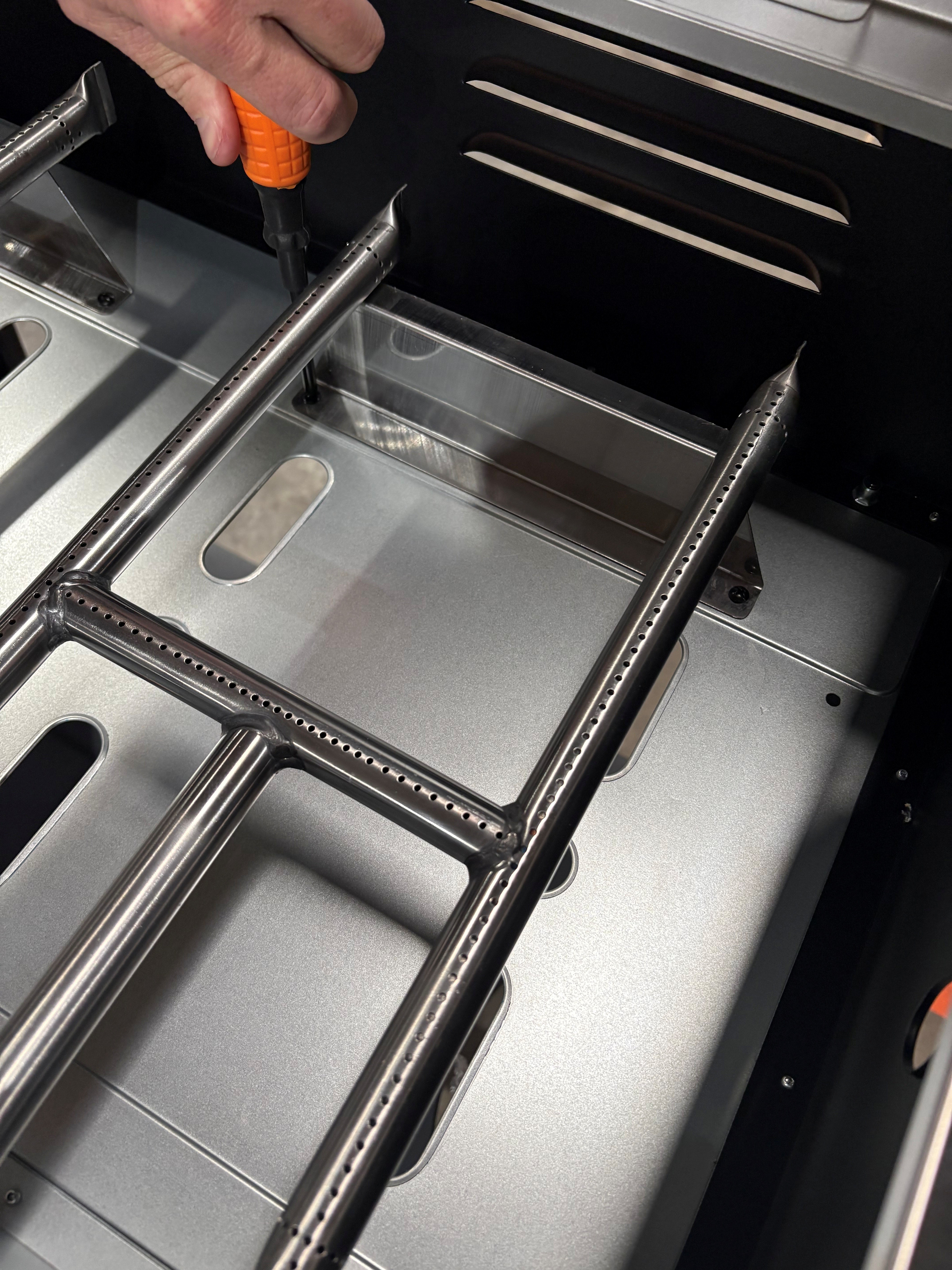 Image of where the screws are located to remove the burner.