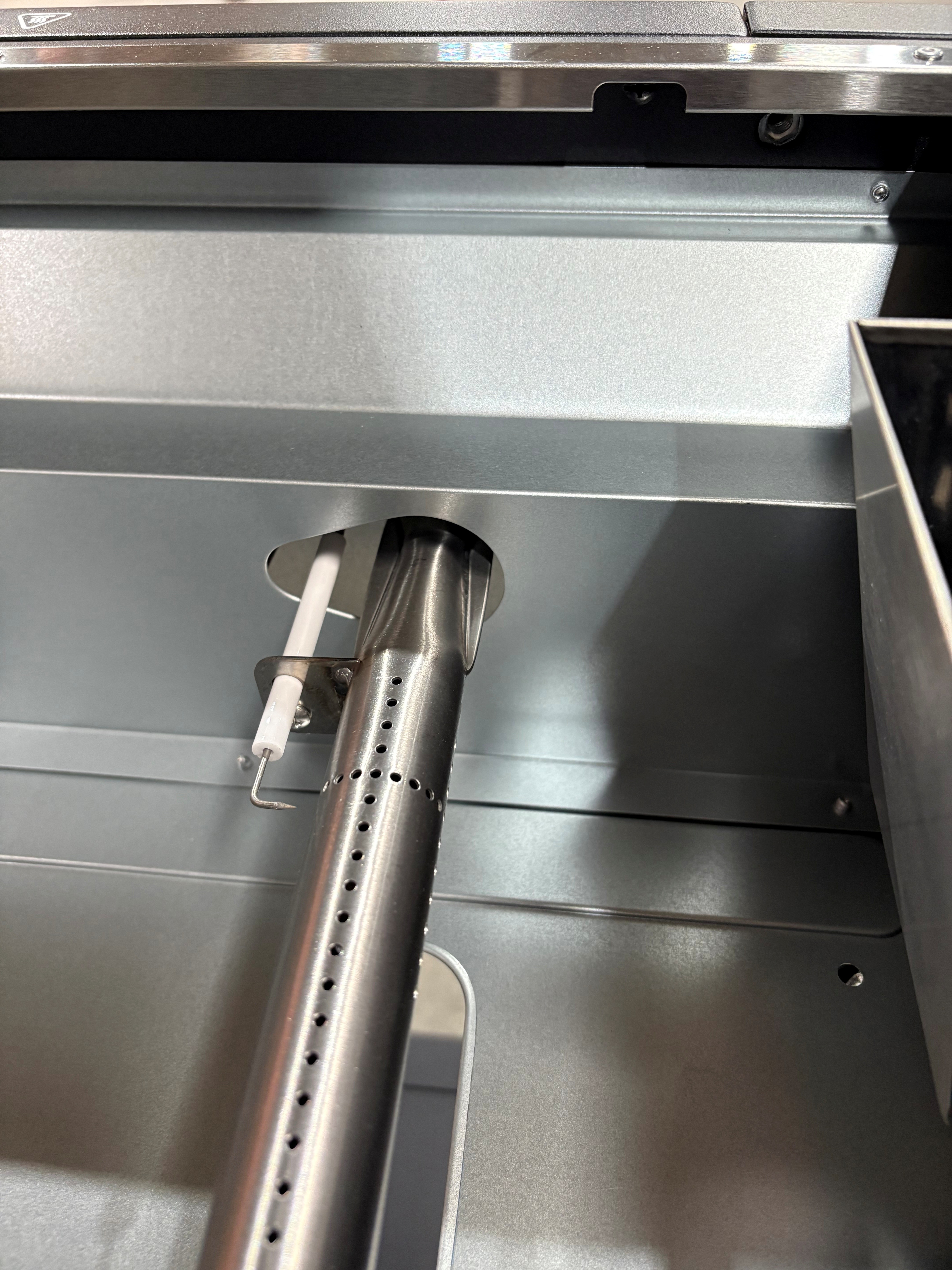 Image showing location of the burner reinstalled into the burner slot.
