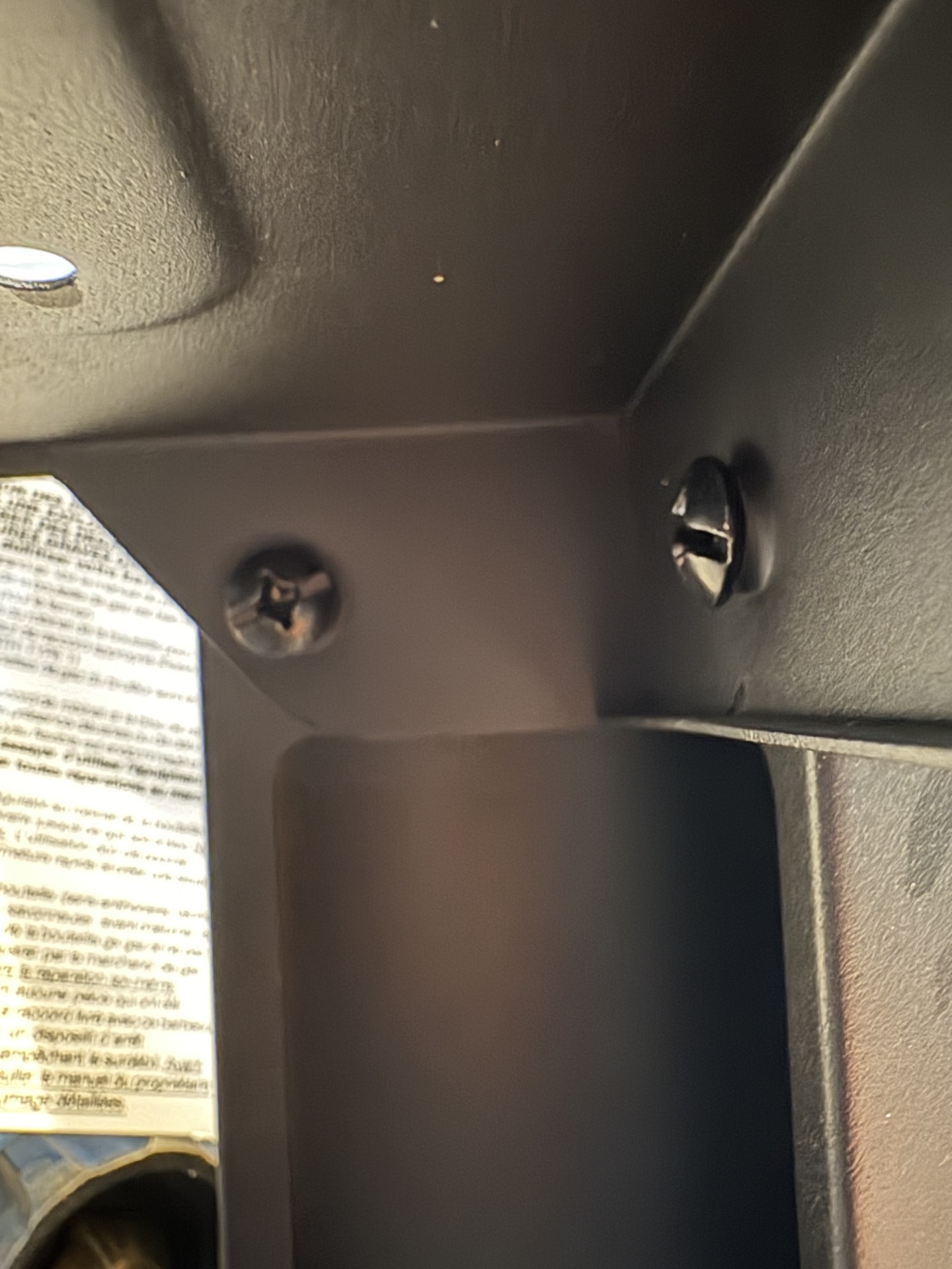 Image showing the screws that need to be removed from the underside. 
