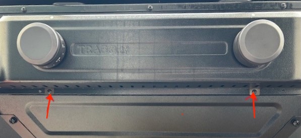Image showing two red arrows pointing to the screws that need to be removed.