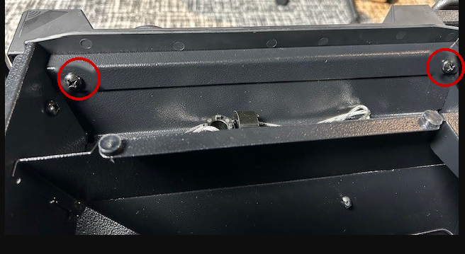 Image of location of screws to remove for a Woodridge controller.